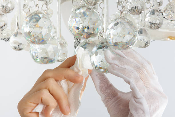 istock hands cleaning the chandelier 931348842