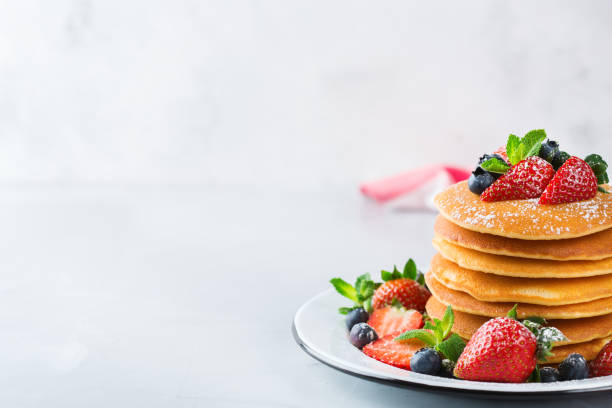 istock Stack of homemade pancakes for breakfast with berries 931351340