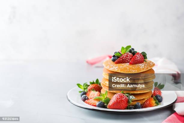Stack Of Homemade Pancakes For Breakfast With Berries Stock Photo - Download Image Now