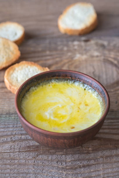 istock Bowl of cheese dip with toasts 931351868
