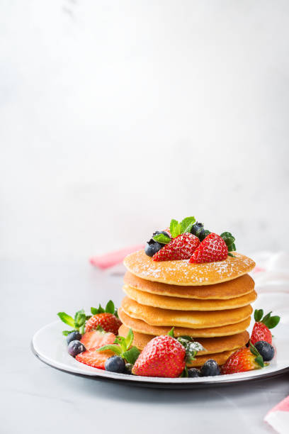 istock Stack of homemade pancakes for breakfast with berries 931352082