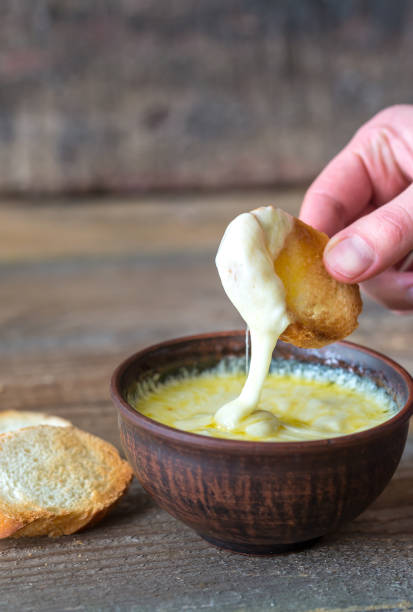 istock Bowl of cheese dip with toasts 931352896