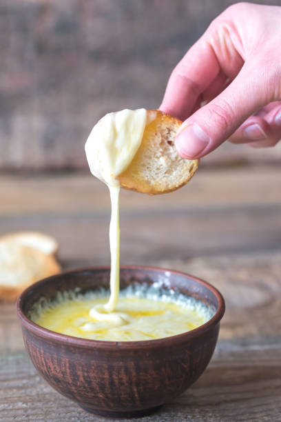 istock Bowl of cheese dip with toasts 931353012