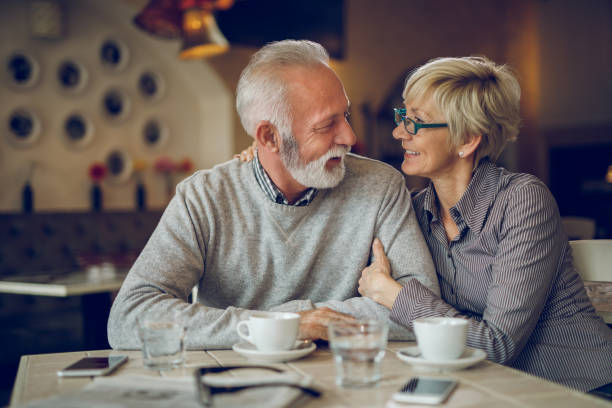 istock Senior couple relaxing in city cafe 931355998