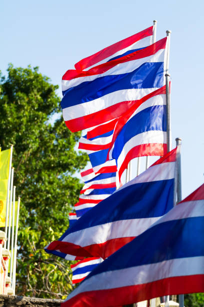 istock Row of thai flags in wind on bridge 931356536