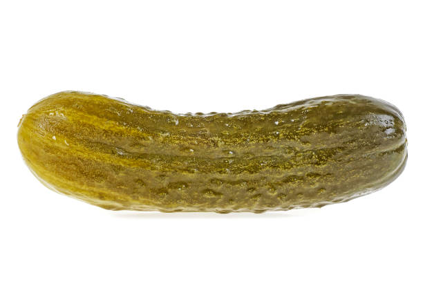istock Close up of pickled cucumber isolated on white background 931357026