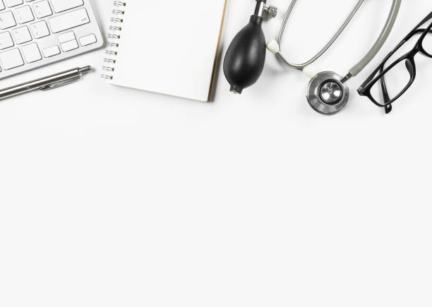 istock White modern doctor's desk table with stethoscope and office supplies. Top view with copy space, flat lay. 931358706