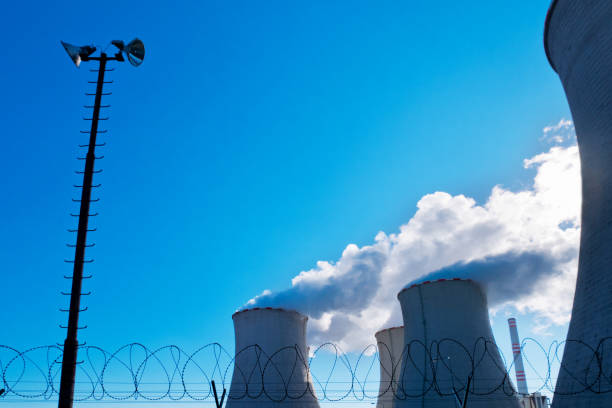 Security of Power Plant with Light and Barbed Wire. taken by RAW barbed wire wire factory sky stock pictures, royalty-free photos & images