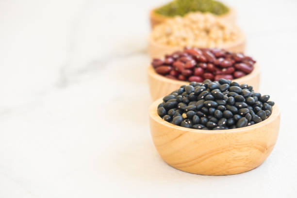istock High Angle View Of Various Beans In Bowls Over White Background 931375174