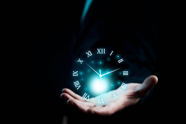 istock Businessman hand holding clock 931376032