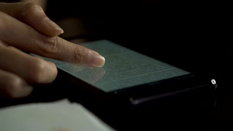 woman hand using smart phone to reading on ebook