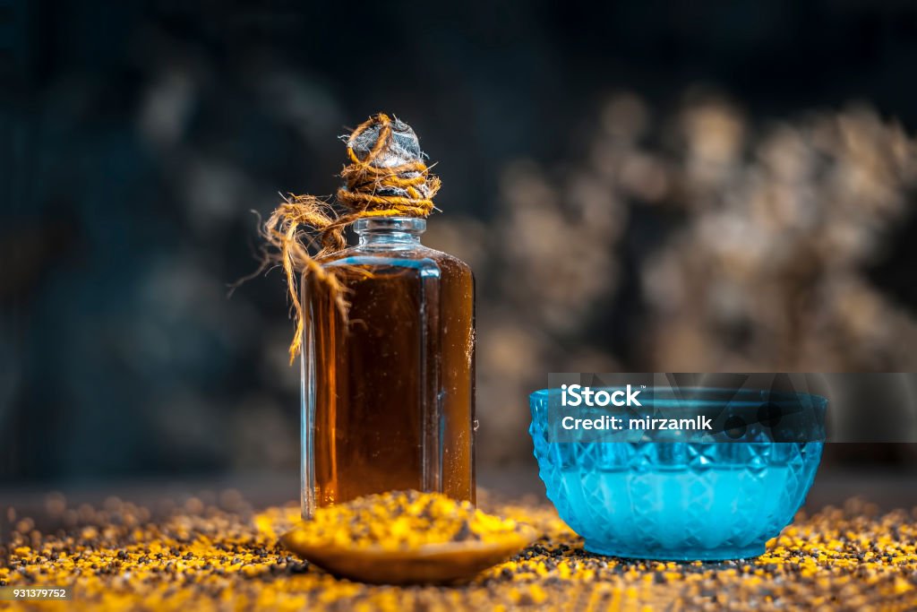 Close up of ingredients for good and smoother skin and thick and long hair is Coconut oil,mustard seeds,and mustards seed's oil. Aromatherapy Stock Photo