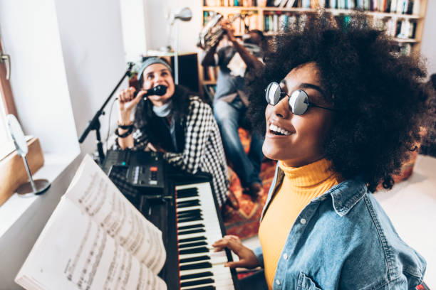 istock Friends playing and singing at home 931381506
