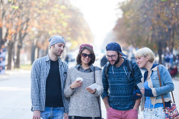 istock Tourists walking on street and having fun 931381592