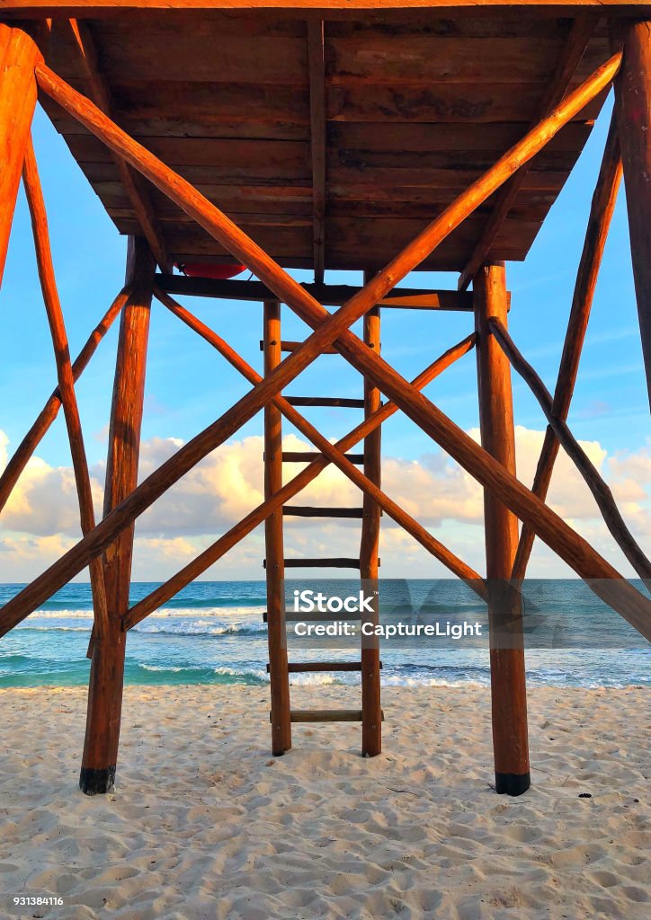 Wooden watchtower on the empty beach at sunset Wooden watchtower on the empty beach at sunset, Cancun, Yucatan, Mexico Backgrounds Stock Photo