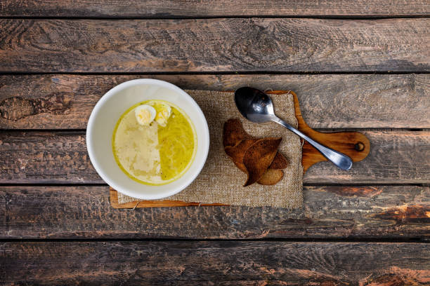 istock Chicken broth with homemade noodles, bread and quail eggs. 931384770