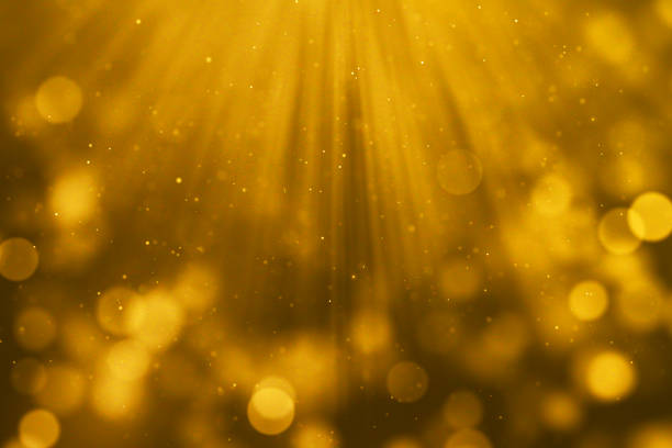 istock christmas gold gradient sparkle glitter dust particles from top on black background with bokeh flowing movement, golden holiday happy new year and valentine day love, relationship 931385178