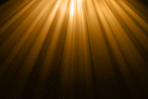 istock christmas gold gradient sparkle glitter dust particles from top on black background with bokeh flowing and ray light, golden holiday happy new year and valentine day love, relationship 931388172