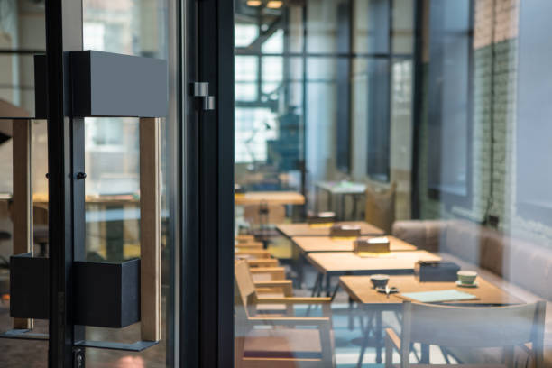 modern door handle on the wooden glass door in front of the cafe. - indoors luxury restaurant store imagens e fotografias de stock