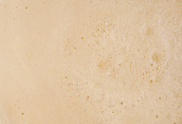 background of black beer froth stock photo
