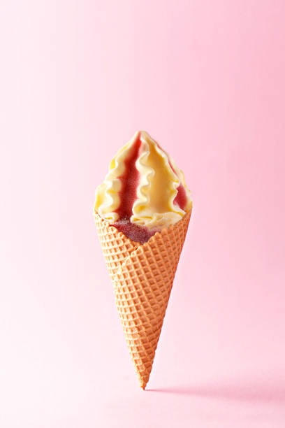 istock Ice cream cone on a pastel background. Refreshing strawberry vanilla ice cream with a wafel cone isolated on pink pastel background. Summer concept 931396068