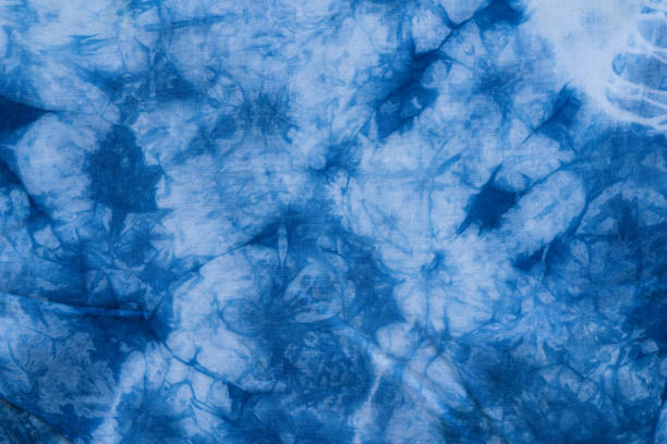istock Pattern of blue tie batik dye on cotton cloth, Dyed indigo fabric background and textured 931396136