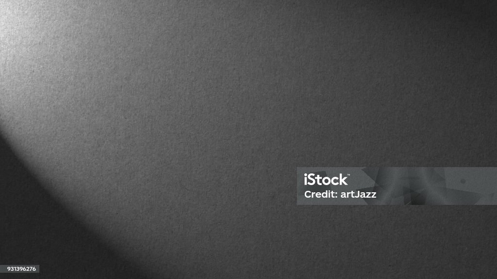 Stone gray background with light shadow texture for building Stone gray background with light shadow texture for building repair decoration interiors. dark grey coal carbon color. Minimalism style Backgrounds Stock Photo