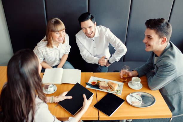 istock Group of young people in cafe 931400696