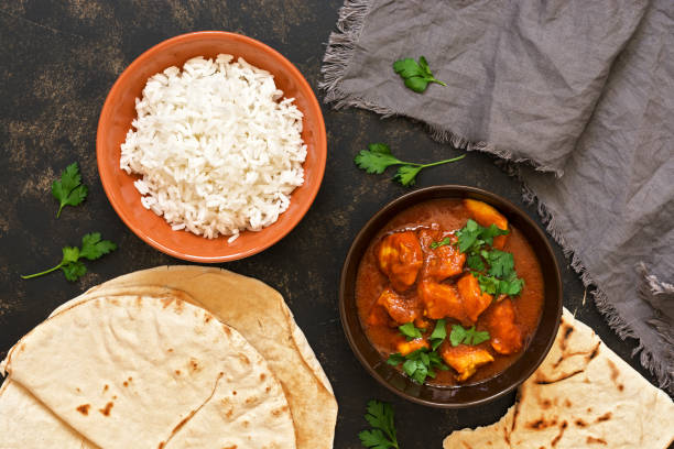 istock Chicken Tikka masala with rice. Indian dish. The view from the top. 931407120