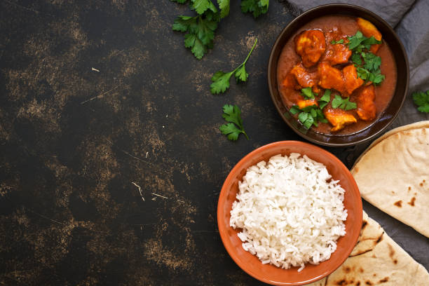 istock Traditional Indian dish chicken Tikka masala. Top view, copy space. 931408340
