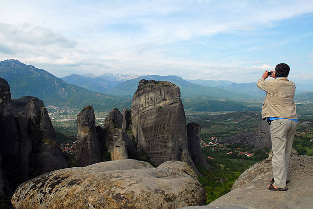 istock Man Taking Photo of Greek Meteora 93140841