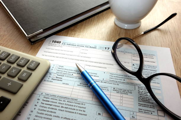 istock Blank 1040 form on desk in the office 931409306