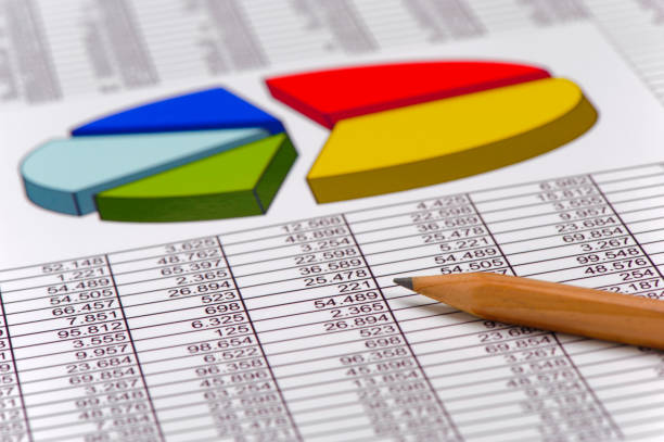 A dynamic stock market concept featuring stacked metallic bar chart, yellow coins, and a rising line graph atop a bright yellow podium and dark background, conveying finance, growth, and investment ideas.
