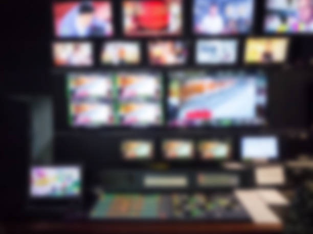 istock Blurred picture video switch of Television Broadcast, working with video and audio mixer, control broadcasts in recording studio. 931419232