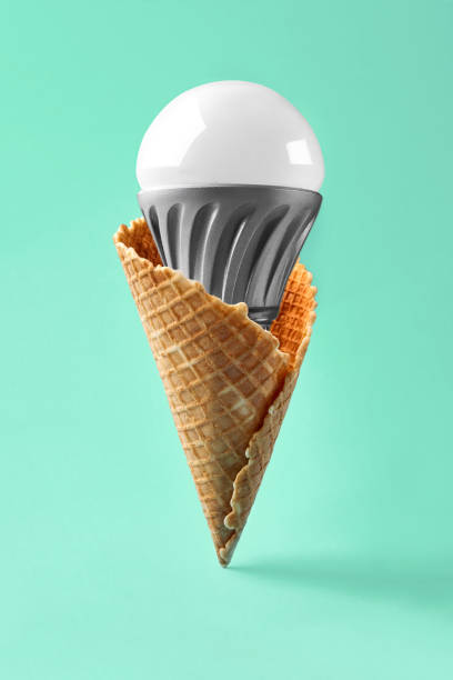 istock Led lamp in ice cream cone, innovation concept 931422102