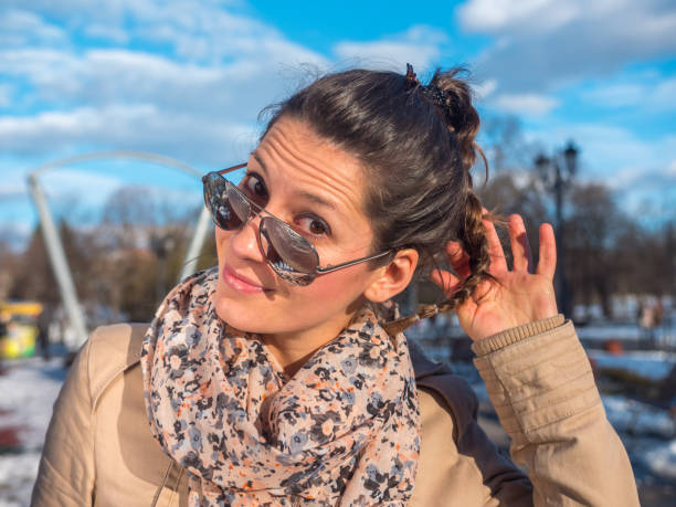 istock Young woman outdoors looking at camera with playful facial expression 931422312