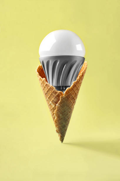 istock Led lamp in ice cream cone, innovation concept 931422978