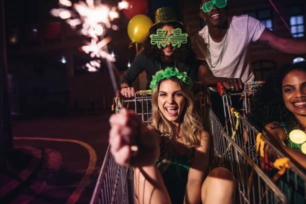 istock Friends celebrate St.Patrick's day with sparklers at night 931423626