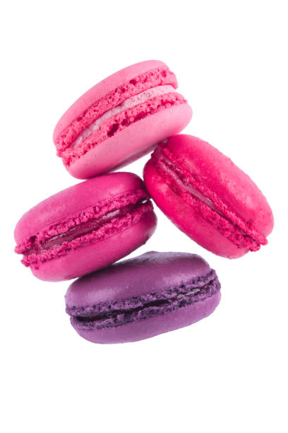 istock macaron pyramid of three pink cookies falling, on white background 931425904