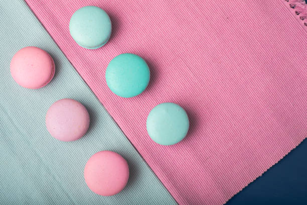 istock Pink and turquoise makarons. Pastel colors. Copy space 931429220