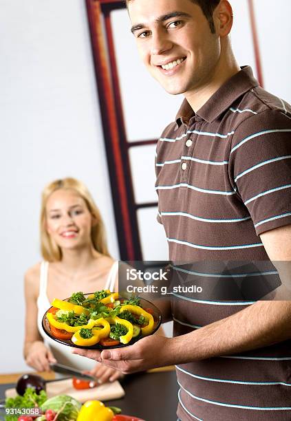 Young Attractive Happy Smiling Couple Cooking At Kitchen Stock Photo - Download Image Now