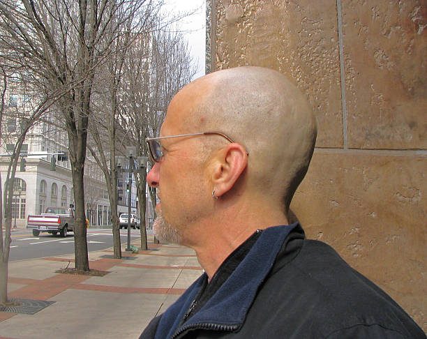 istock Profile of Bald Man in City 93143238