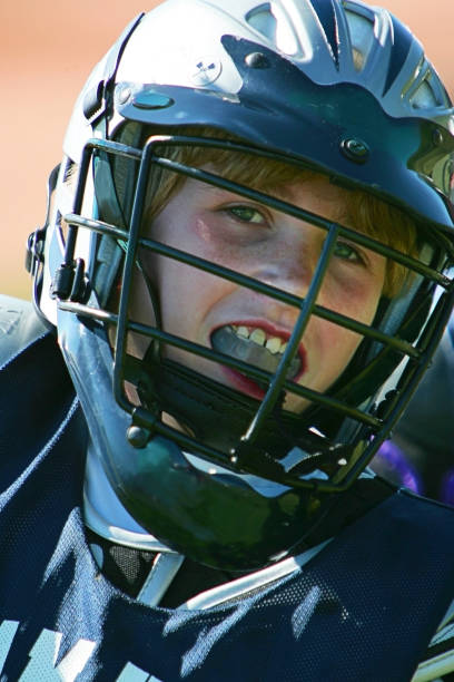 istock Young Male Lacrosse Player Smiles in Headshot 93143640