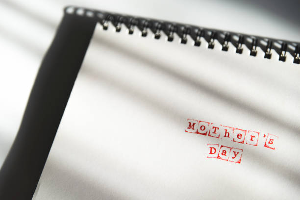 istock mothers day text on white sheet made via stamp 931442618