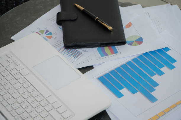 istock Laptop, report documents, pen, notebook on the office desk 931442804