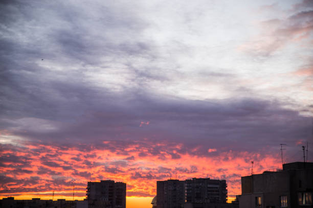 istock beautiful orange sunrise. view from window on cityscape 931446190