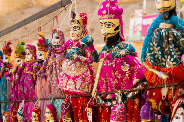 istock Traditional Rajasthani indian puppets handing from a wall 931449542