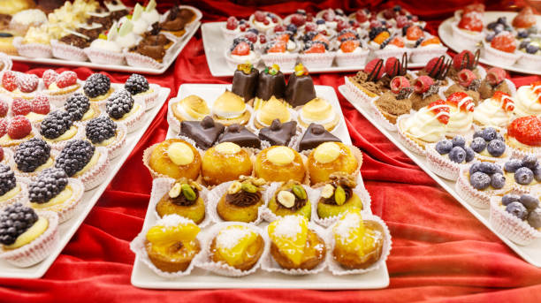 istock Different colorful Tasty beautiful cakes on a show-window in cafe 931449884