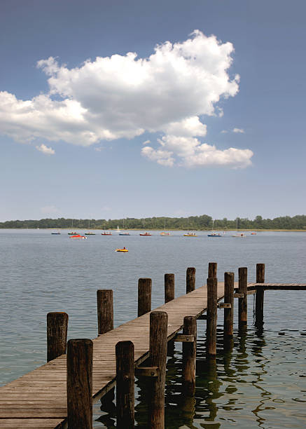 istock Chiemsee, jetty boat caravan and cloud off Herrenchiemsee 93145066