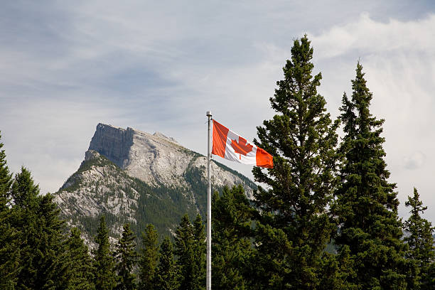 istock Canadian Flag in front of Mount Rundle (Rockies) 93145086
